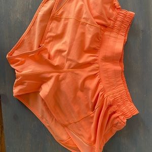 neon orange Lululemon hotty hot shorts